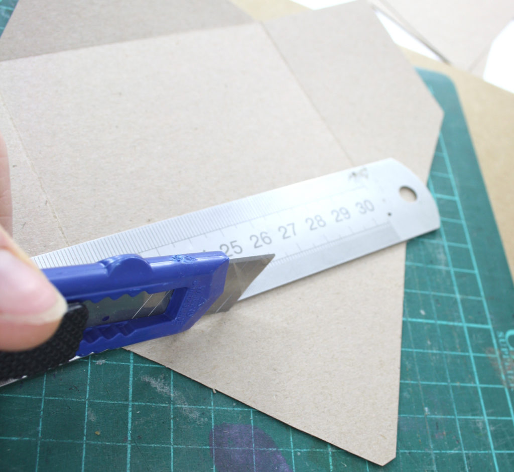 step 3 using the back of your knife score the fold lines at all sides of your envelope